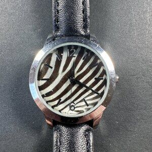 AVON SAFARI STRAP WATCH ZEBRA PRINT SHINY SILVERTONE STAINLESS STEEL, BLACK BAND